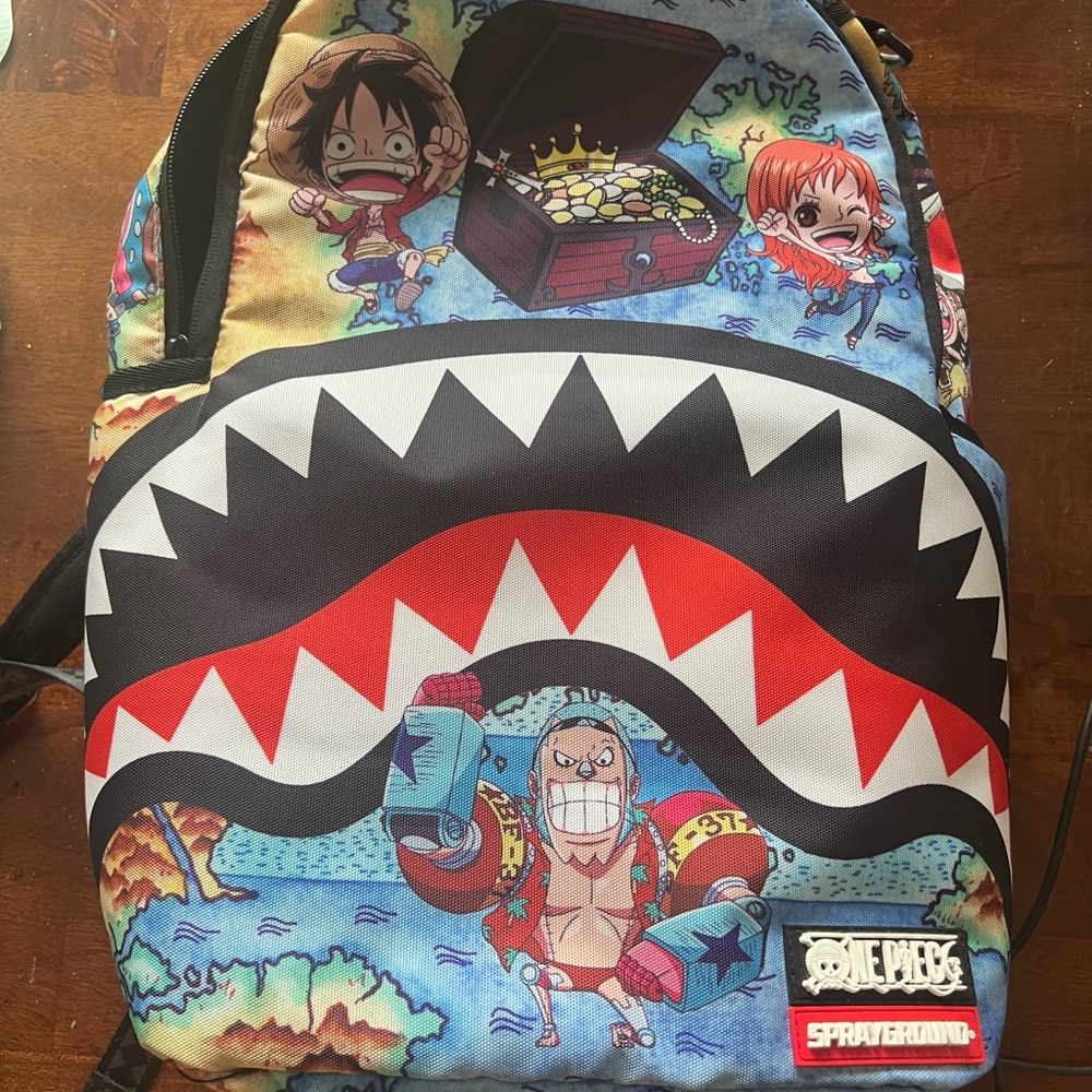 Sprayground One Piece Blue and Red Backpack